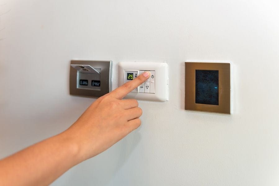 Image of control panels linking to different hvac systems. Heat Pump Versus Furnace.