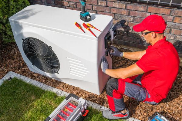 Image of someone working on a heat pump. What Type of Heat Pump/mini split Should I Buy?