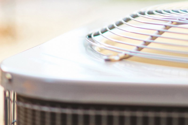 Heat Pump vs. Furnace: Which Heating System Is Right for You? Close up photo of a heat pump.